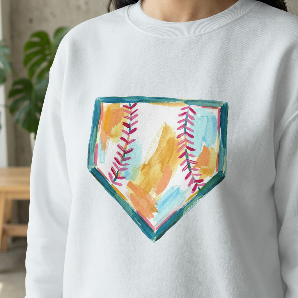 Watercolor baseball home plate design on a white sweatshirt.