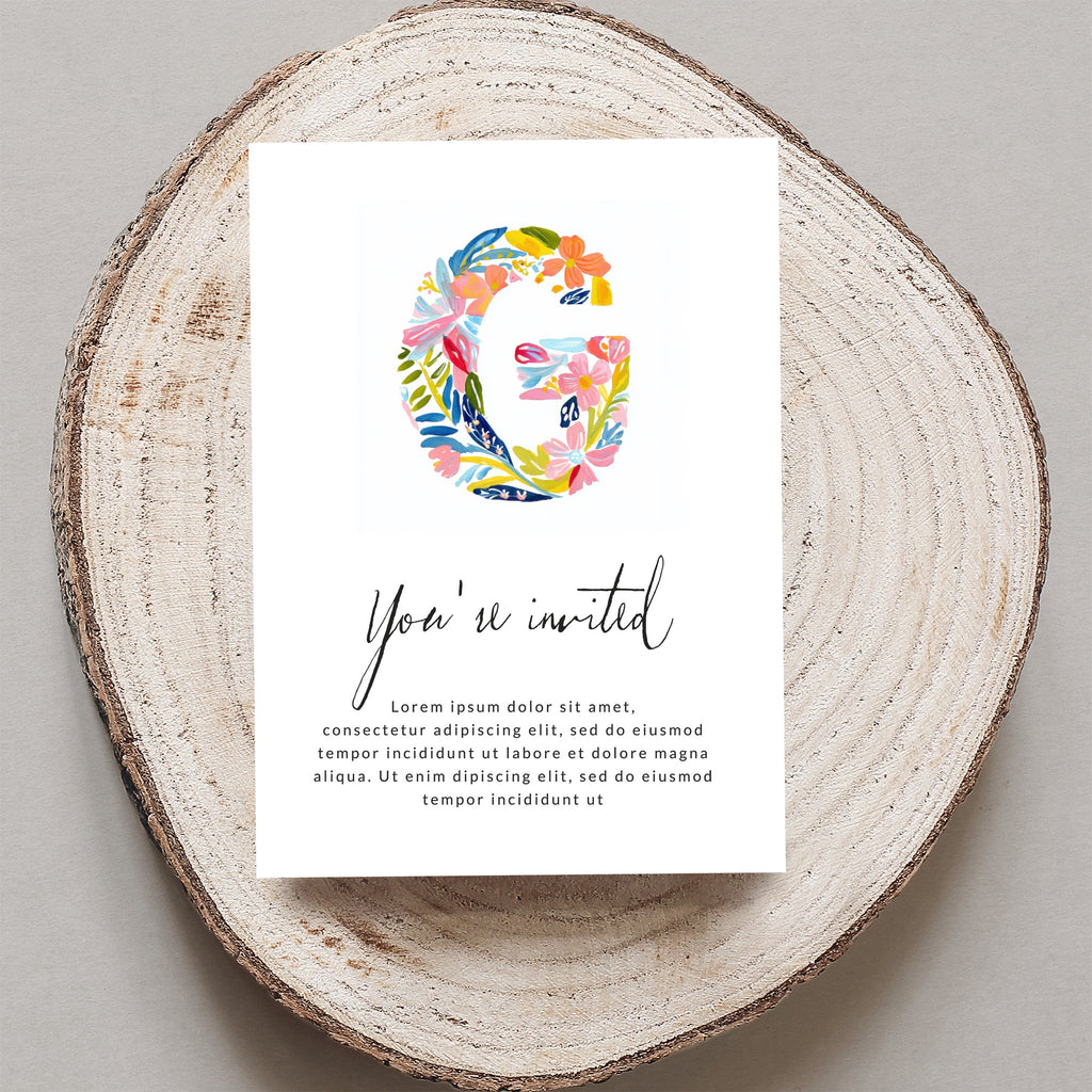 "G" initial with floral design on invitation for "You're invited" event.