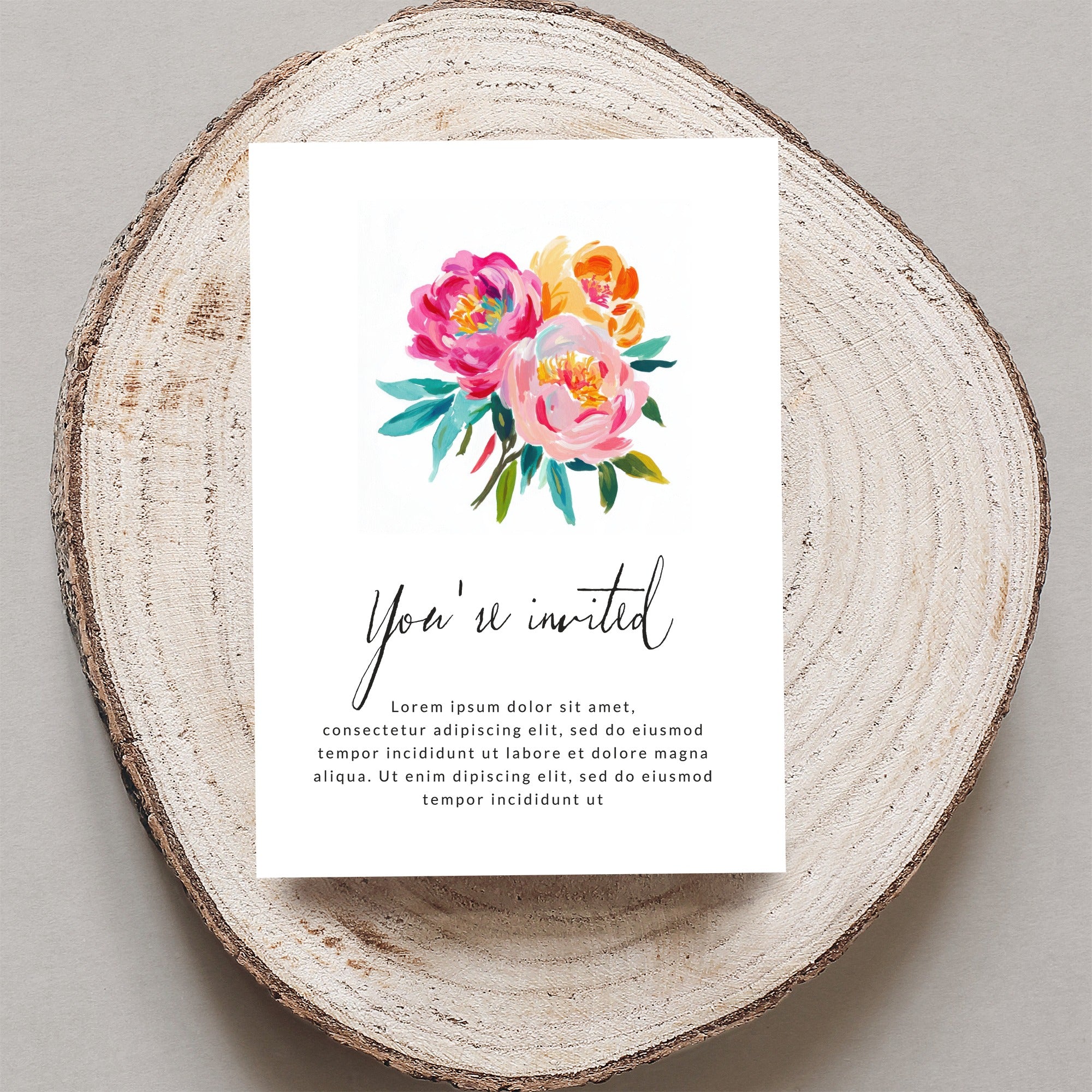 Invitation with watercolor floral bouquet and "You're invited" text.