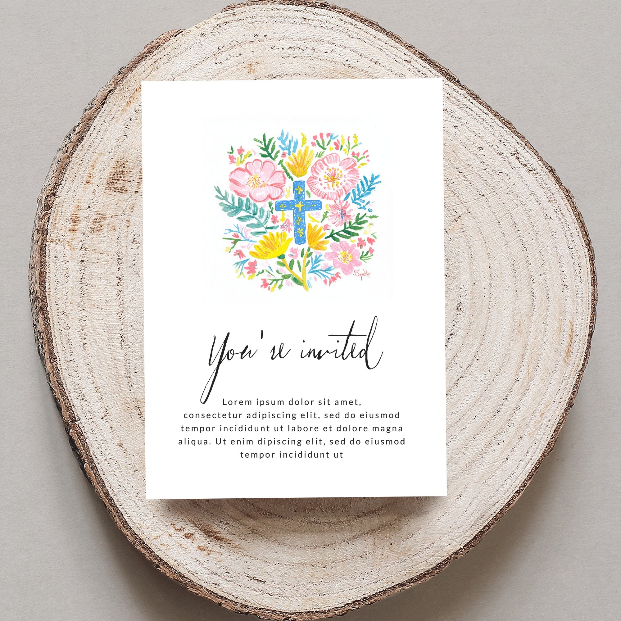 Invitation with "You're invited" and floral cross design.