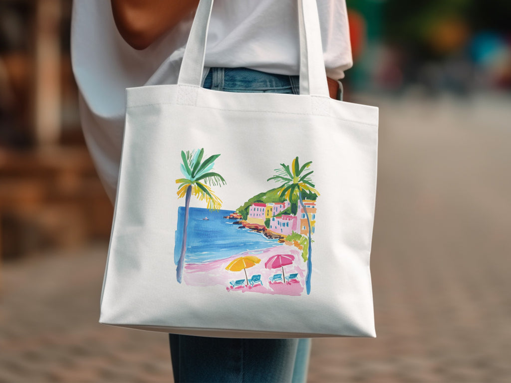 White tote bag with a watercolor beach scene featuring palm trees and colorful buildings.