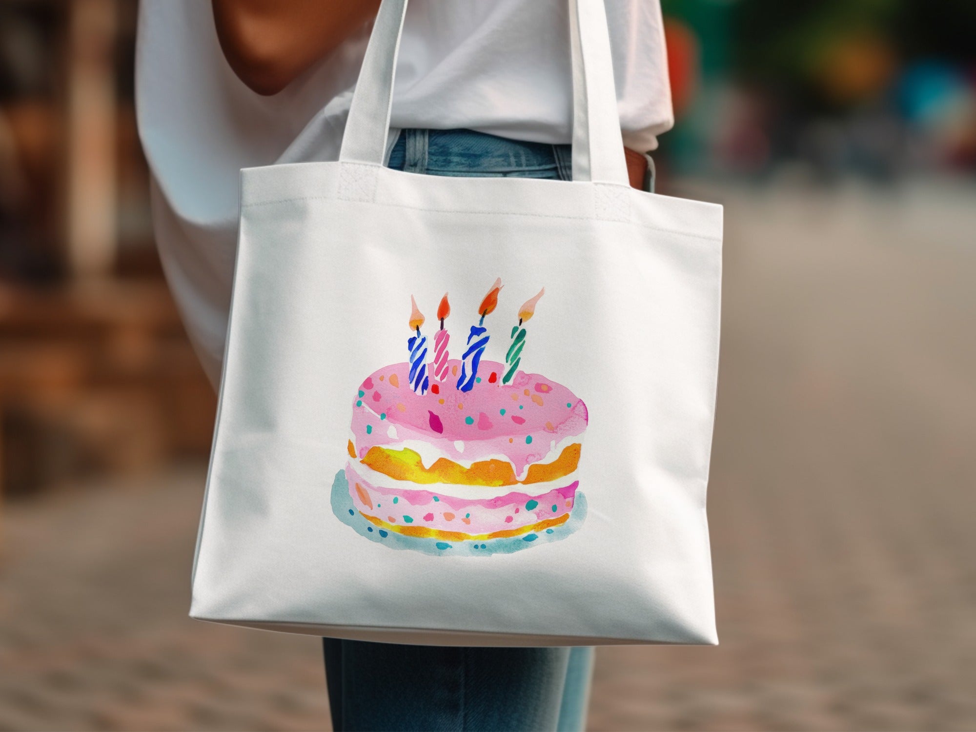 Watercolor illustration of a pink frosted birthday cake with lit candles.