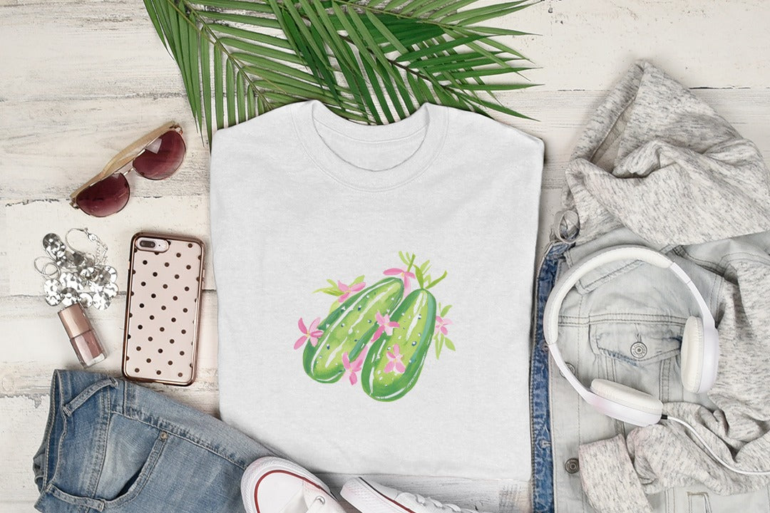 White t-shirt with watercolor dill pickle design and pink flowers.