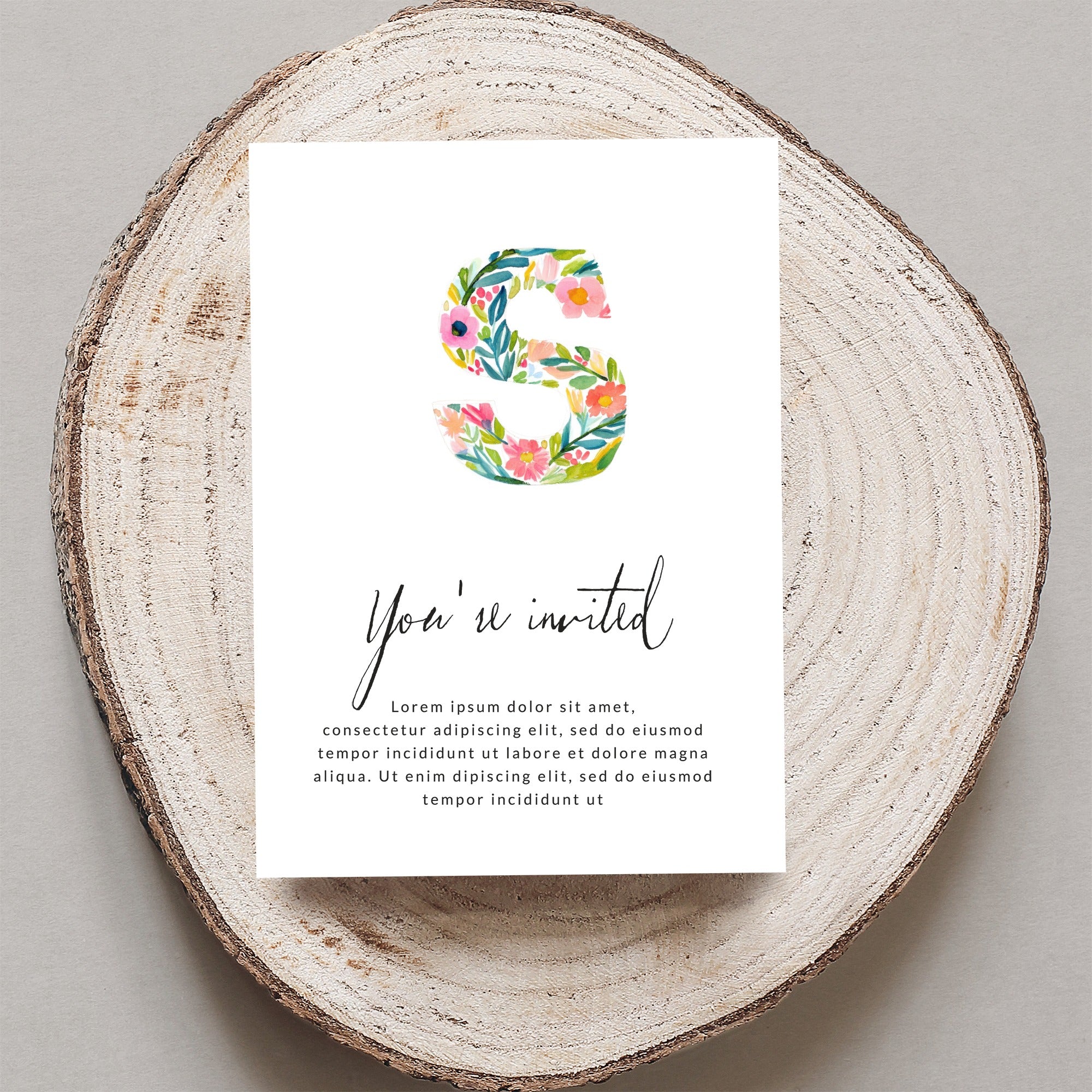 Floral "S" invitation with "You're invited" text and placeholder copy.