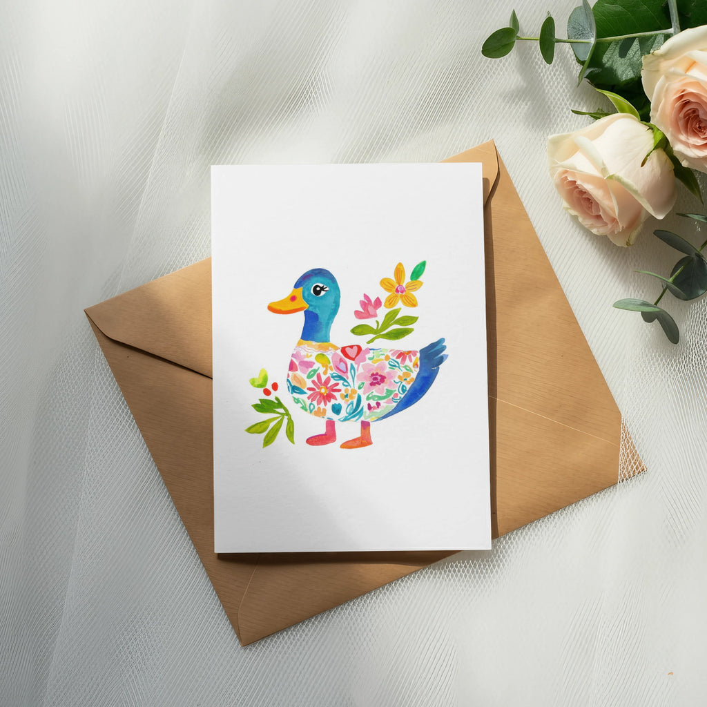 Card with a painted duck wearing a colorful floral sweater.