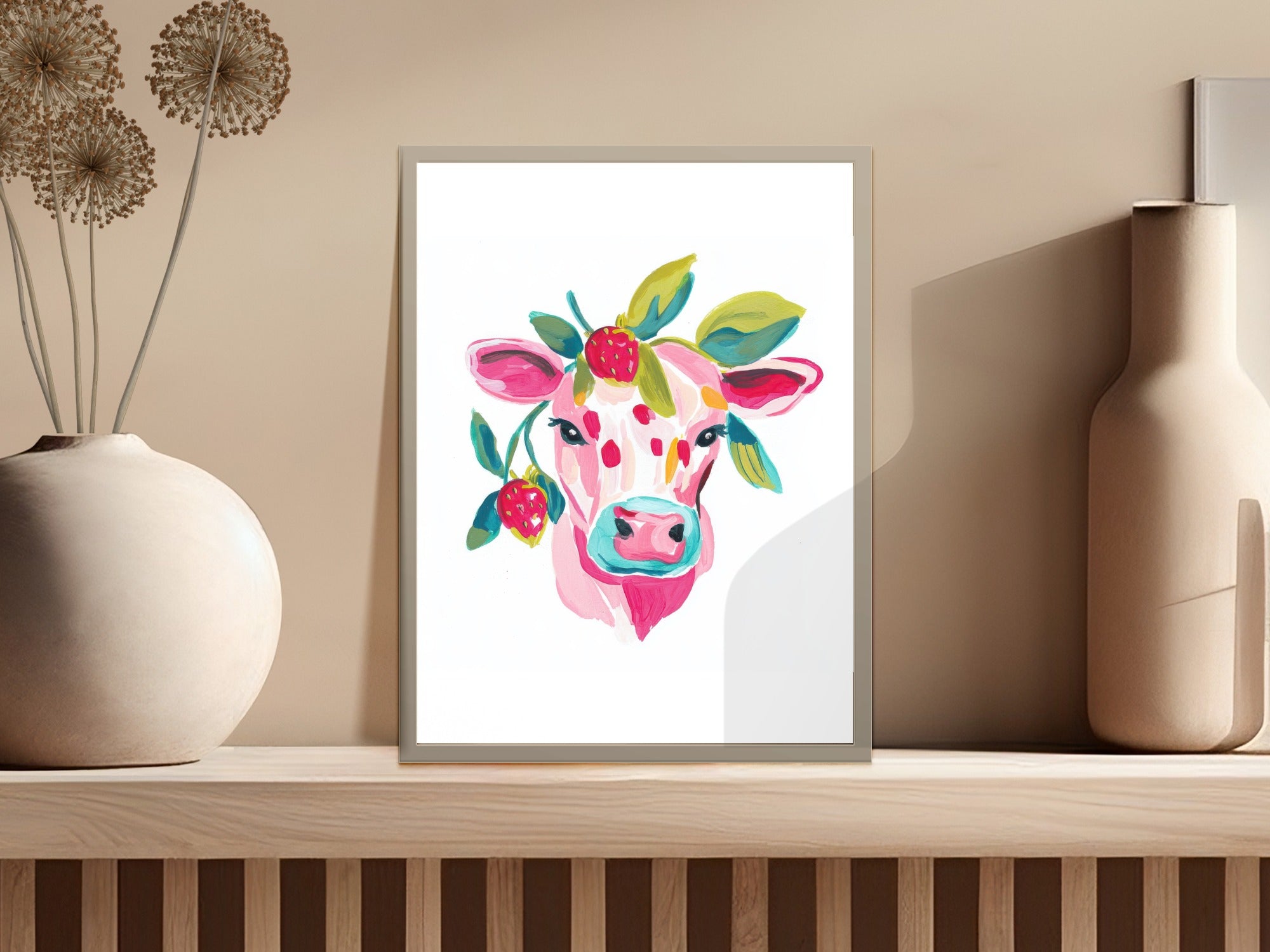 Watercolor painting of a pink cow with berries and leaves on its head.