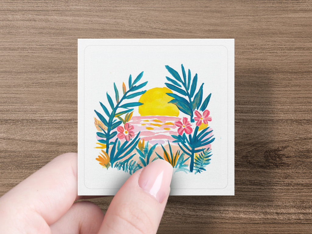 Watercolor sunset over the ocean with tropical leaves and flowers.