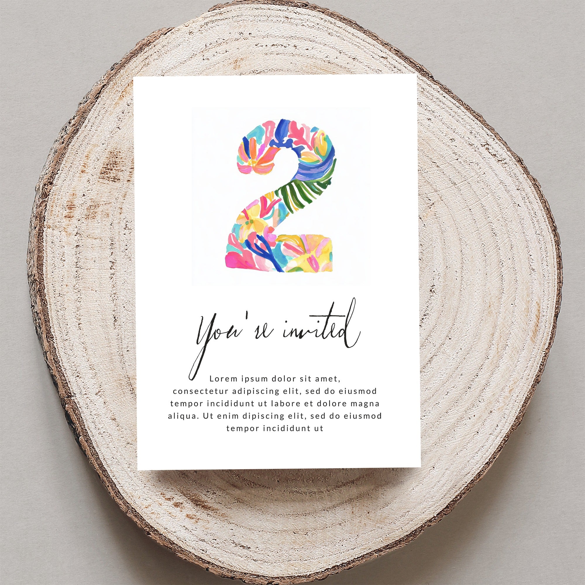 Birthday invitation card with colorful "2" and "You're invited" text.