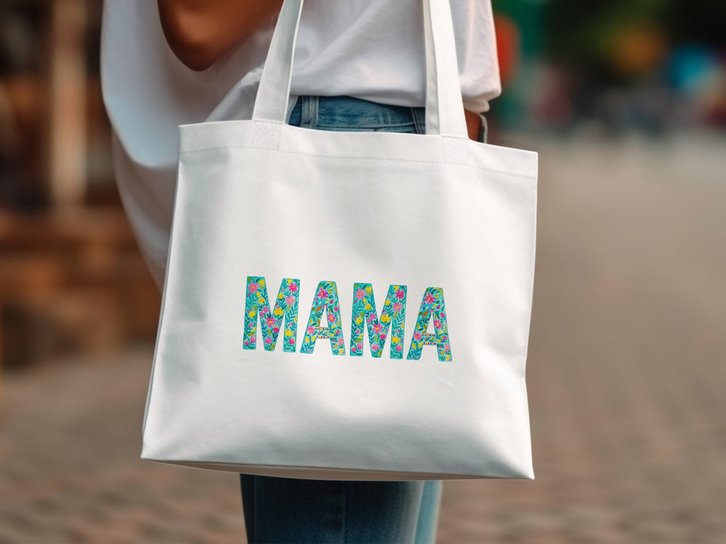 White canvas tote bag with colorful floral "MAMA" lettering.
