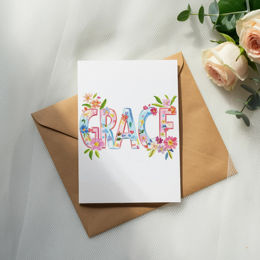 "Grace" written in colorful floral watercolor letters on a card.