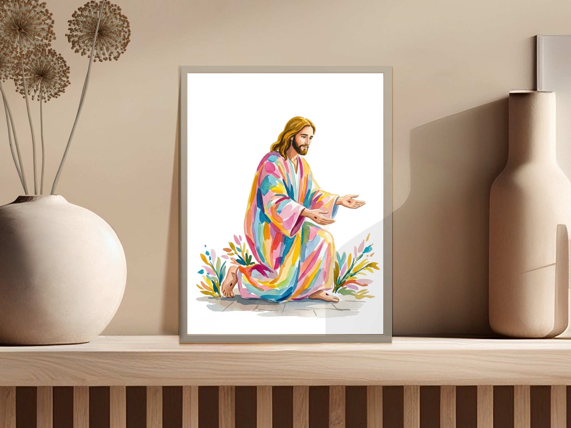 Jesus in colorful robe kneels with open hands on a rainbow path.