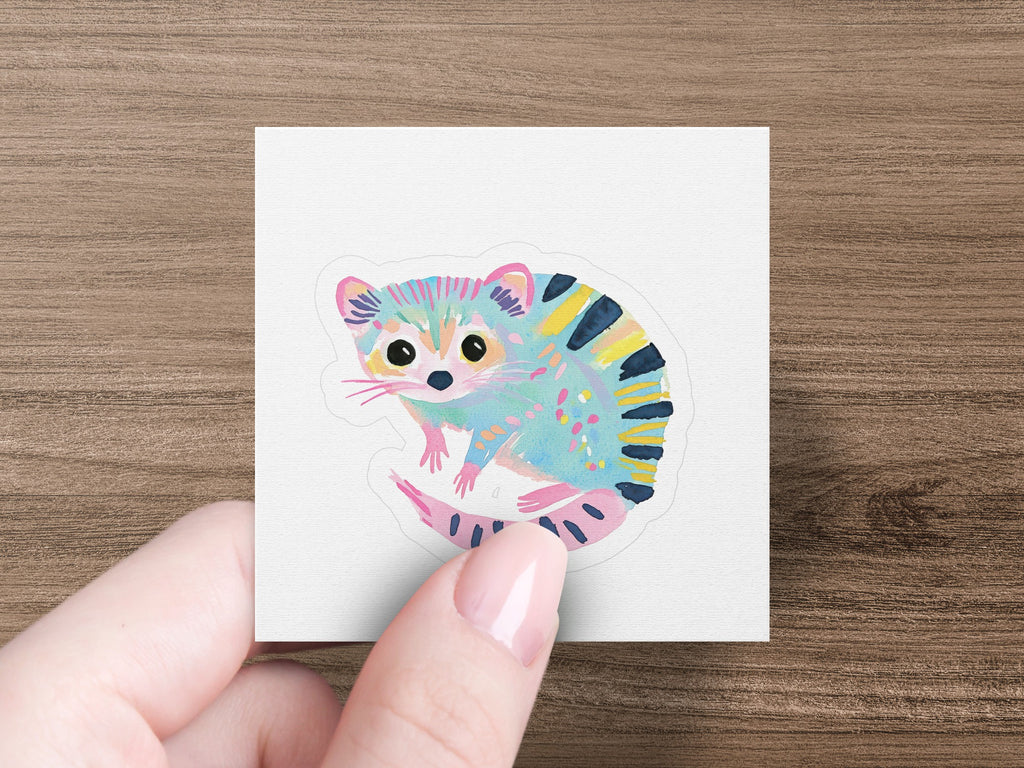 A colorful cartoon opossum with blue, pink, and yellow stripes.