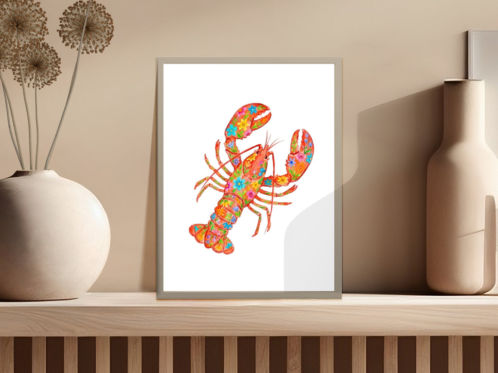 Colorful lobster illustration with floral patterns on a framed print.