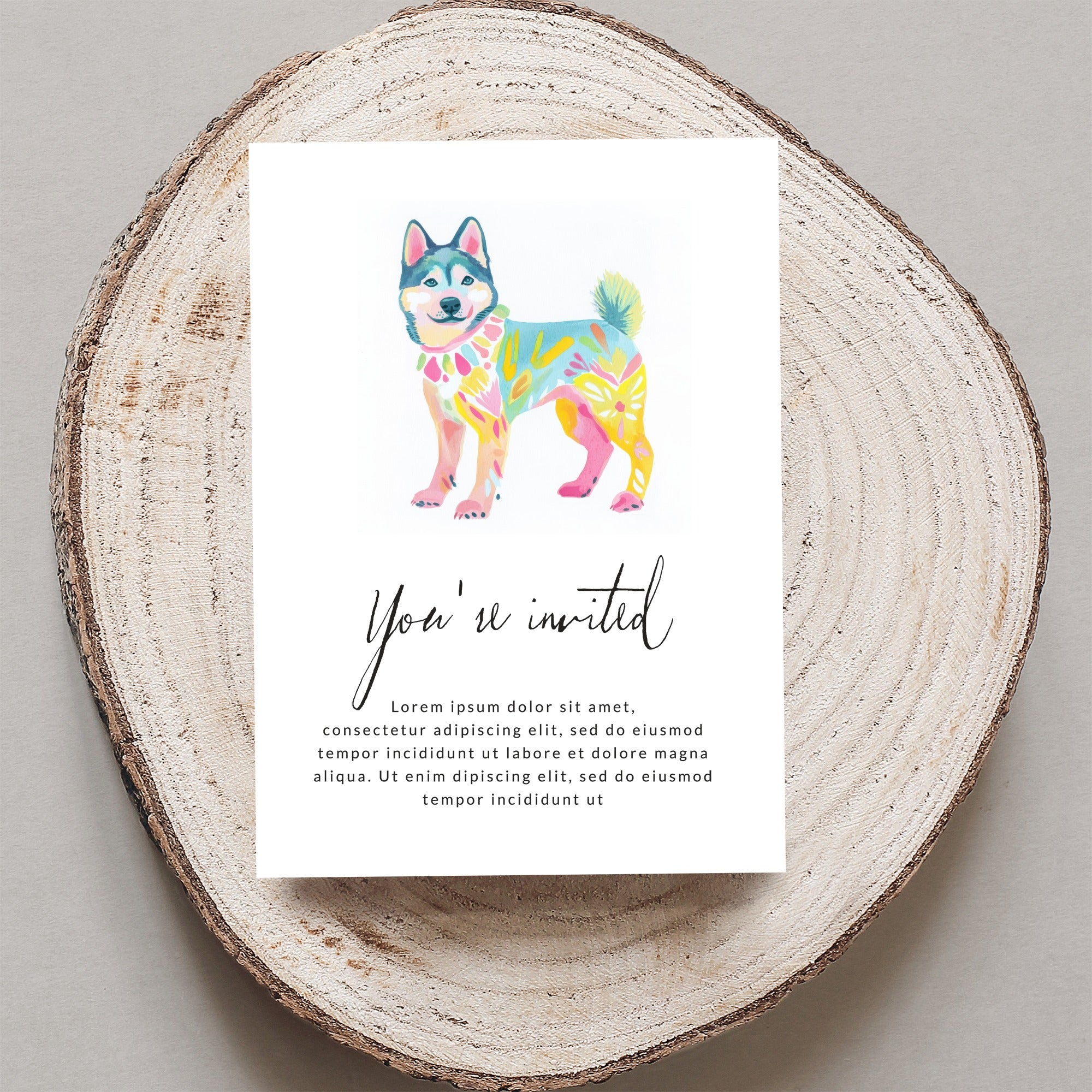 Watercolor husky on invitation card with "You're invited" text.
