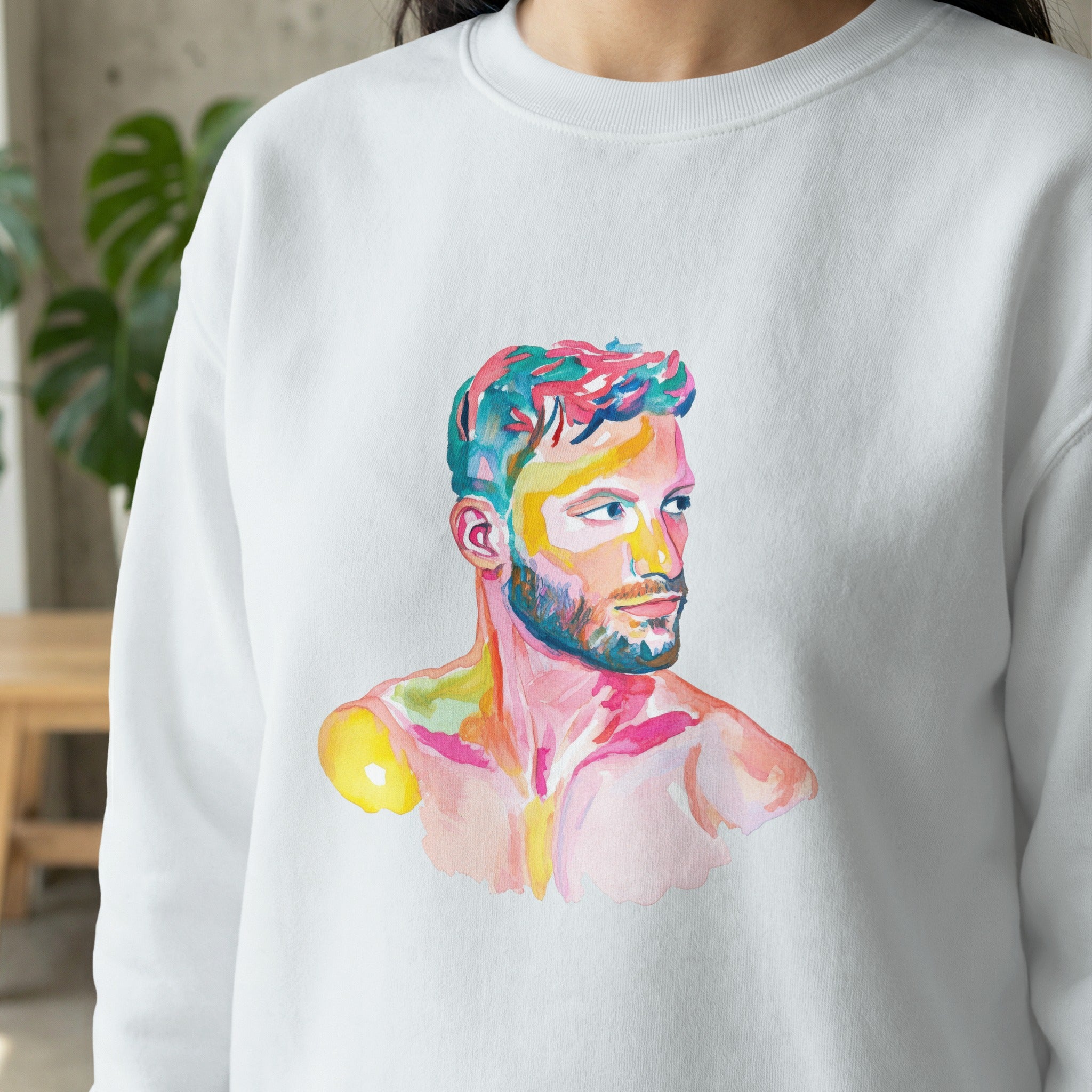 Watercolor portrait of a man's head and shoulders on a white sweatshirt.