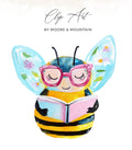 Bee wearing glasses reads a book with watercolor wings.