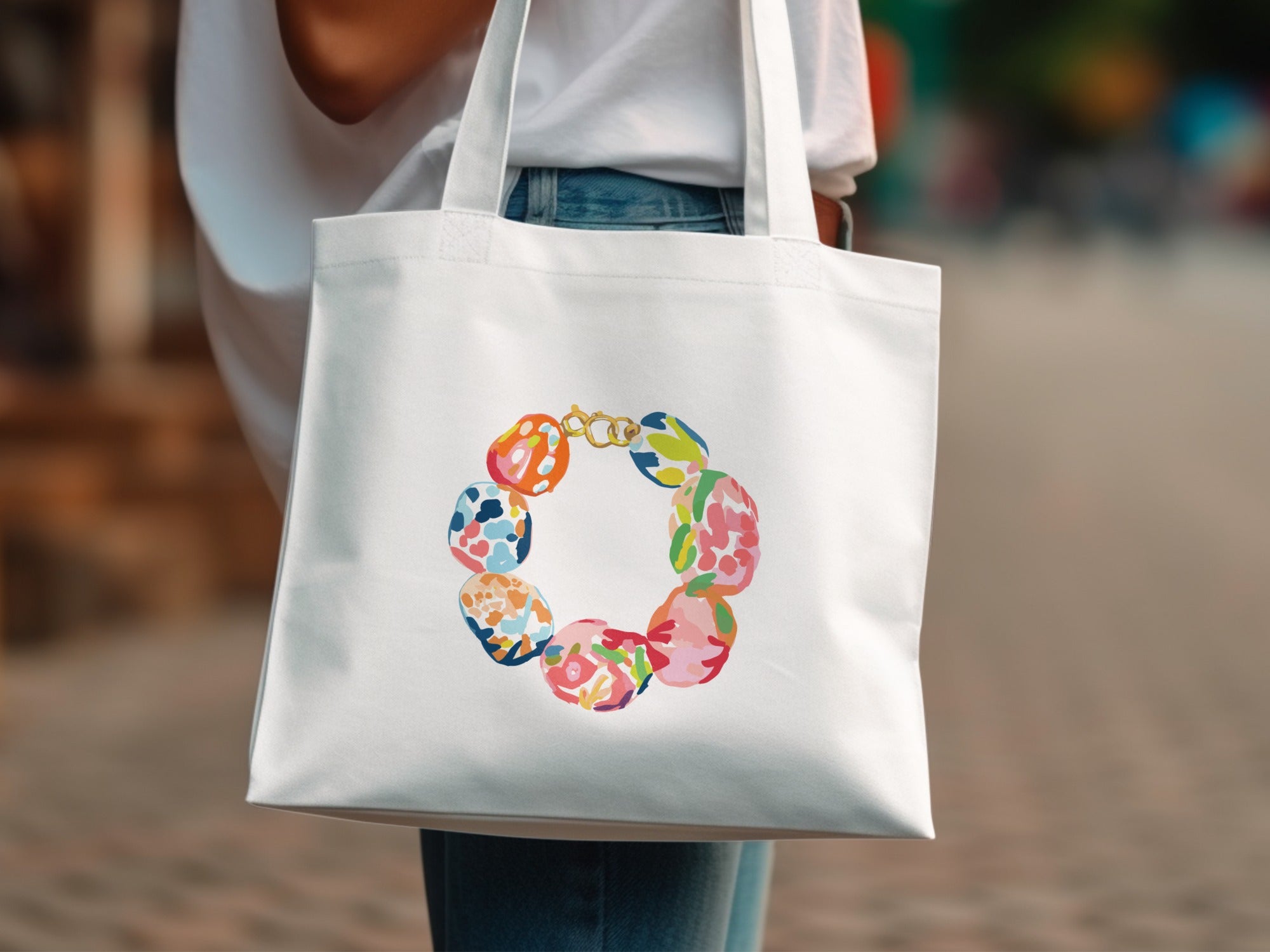 White tote bag with colorful floral pattern circular design.