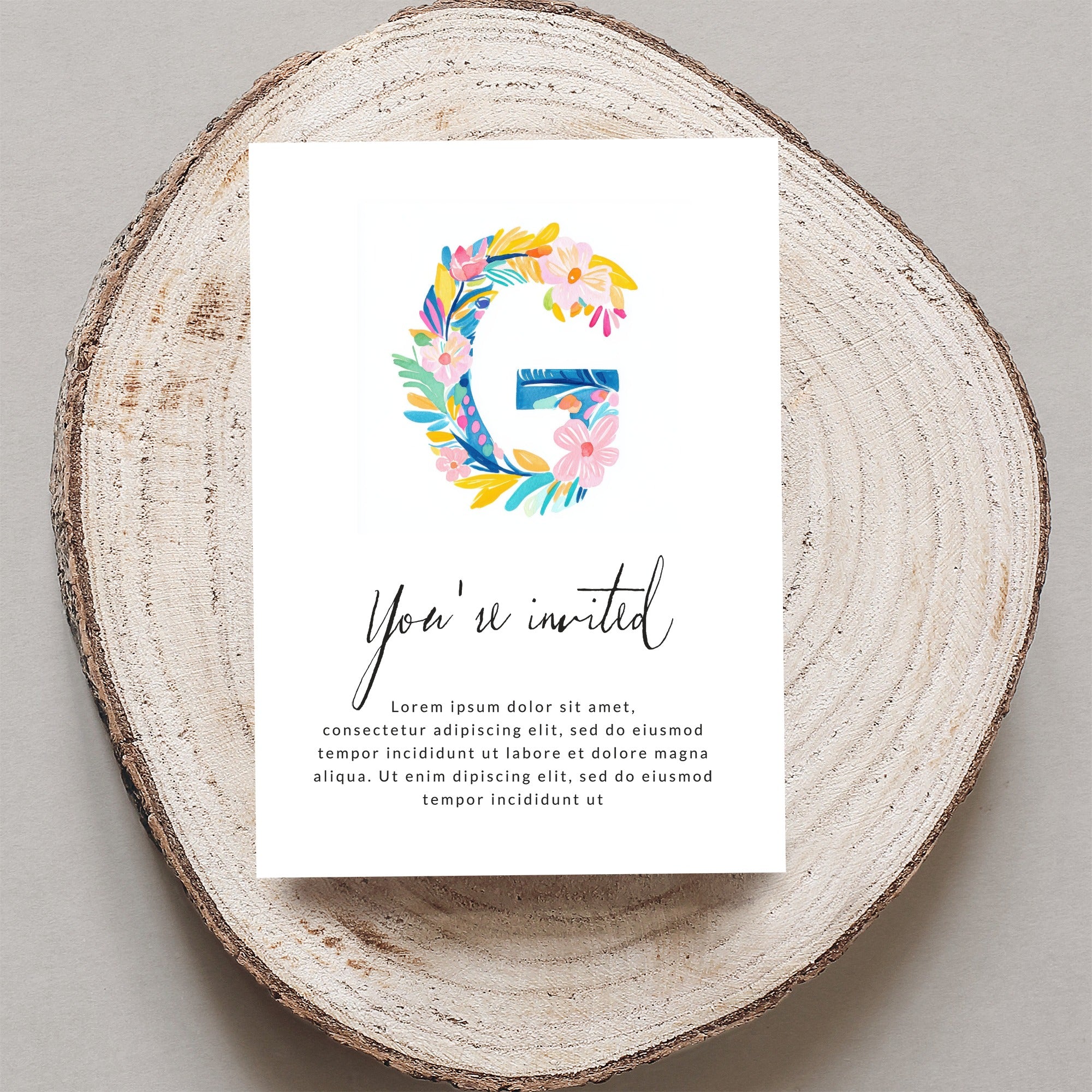 Invitation card with "You're invited" text and floral "G" illustration.