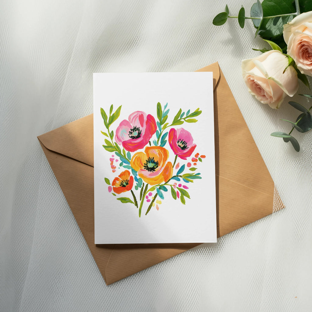 Watercolor floral illustration on a card with a brown envelope.