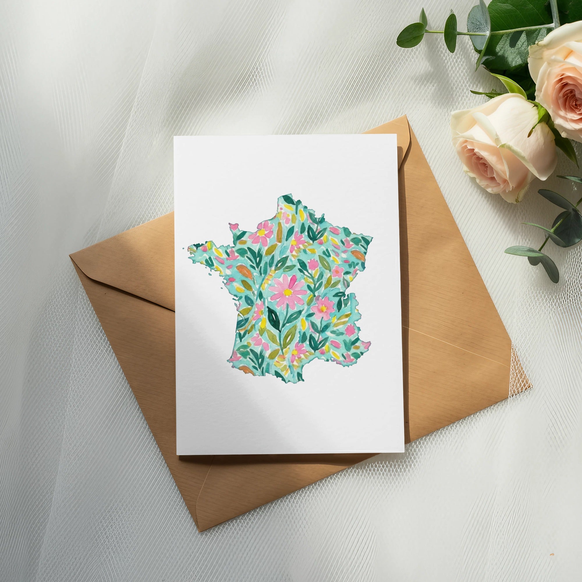 France map outline with floral pattern on white cardstock.