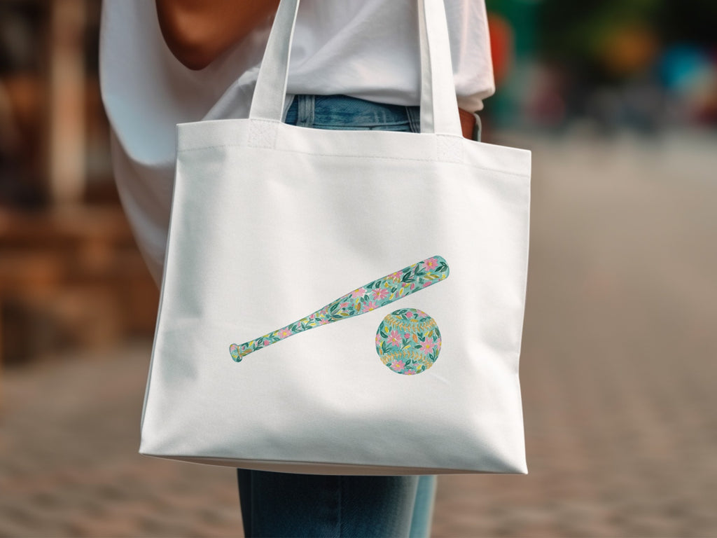White tote bag with floral baseball bat and ball design.