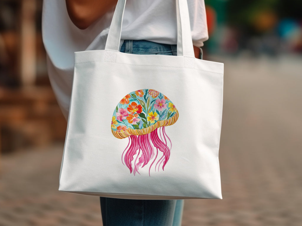 White tote bag with colorful floral jellyfish illustration.