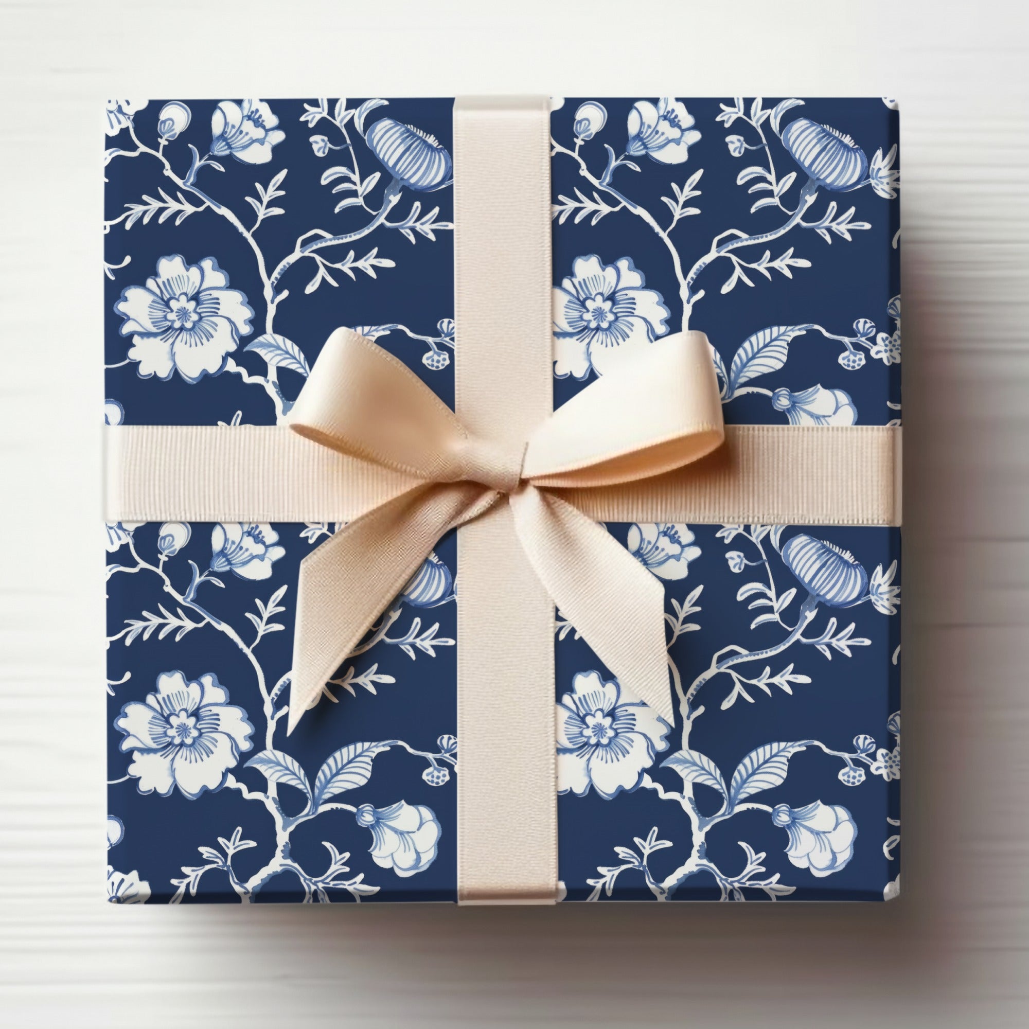 Elegant Blue Floral Gift Wrap with Cream Ribbon design
