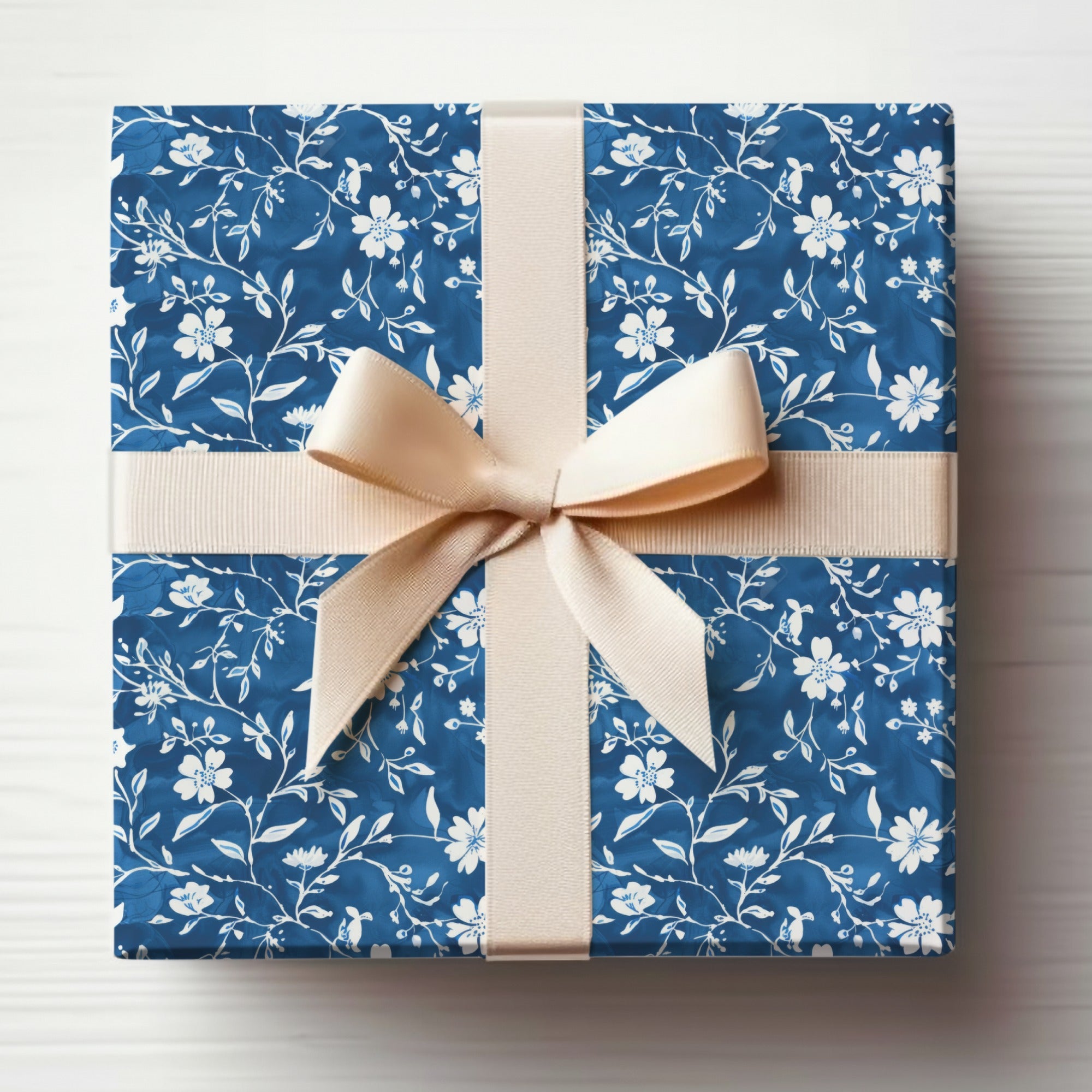Elegant Blue Floral Gift Wrap with Cream Bow Design