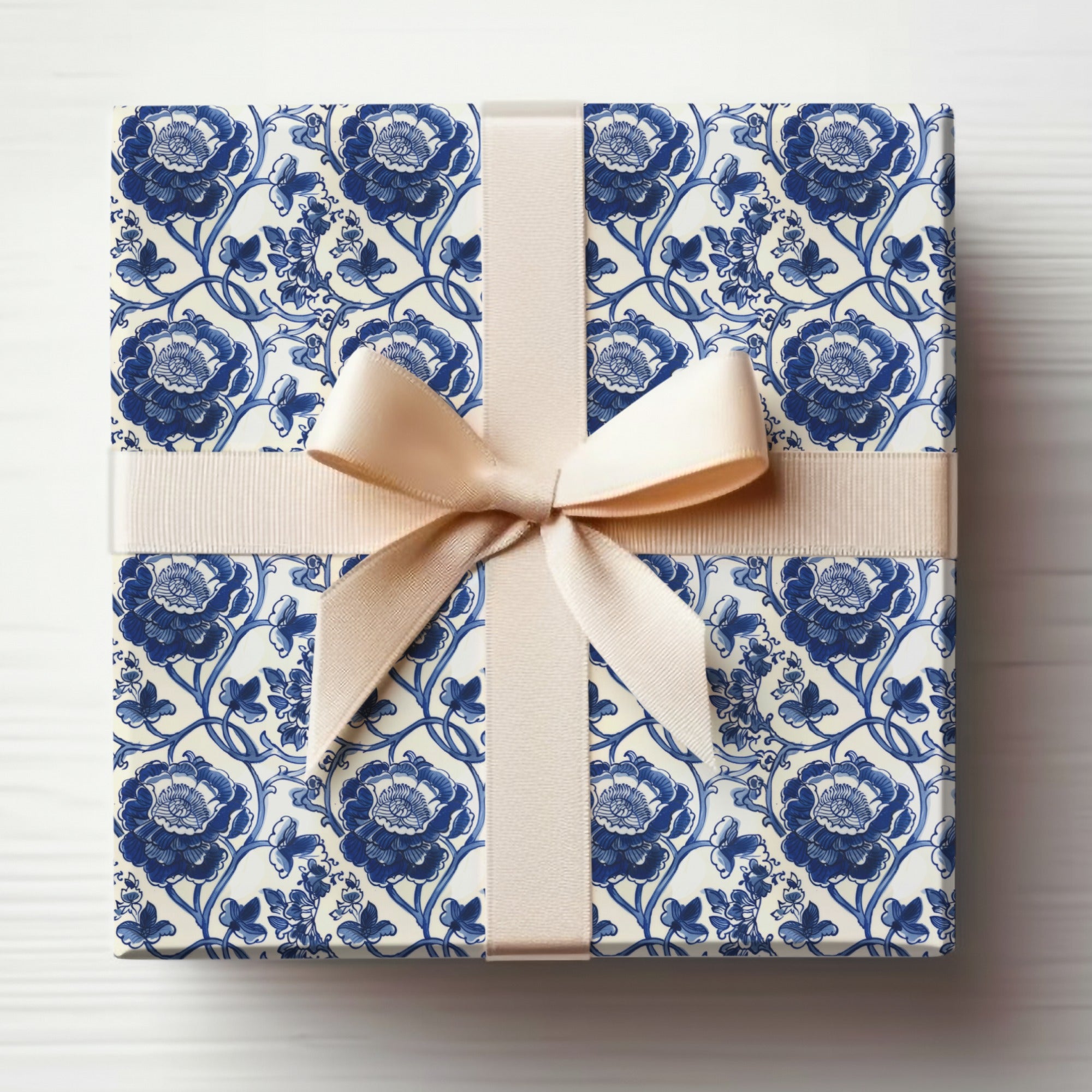 Elegant Blue Floral Gift Wrap with Bow for Any Occasion