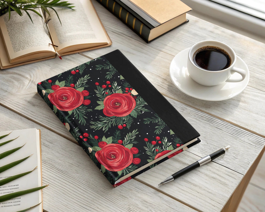 Floral Arrangement on Black Background Artful Design notebook with red flowers, green leaves, open books, and a cup of coffee on a wooden table