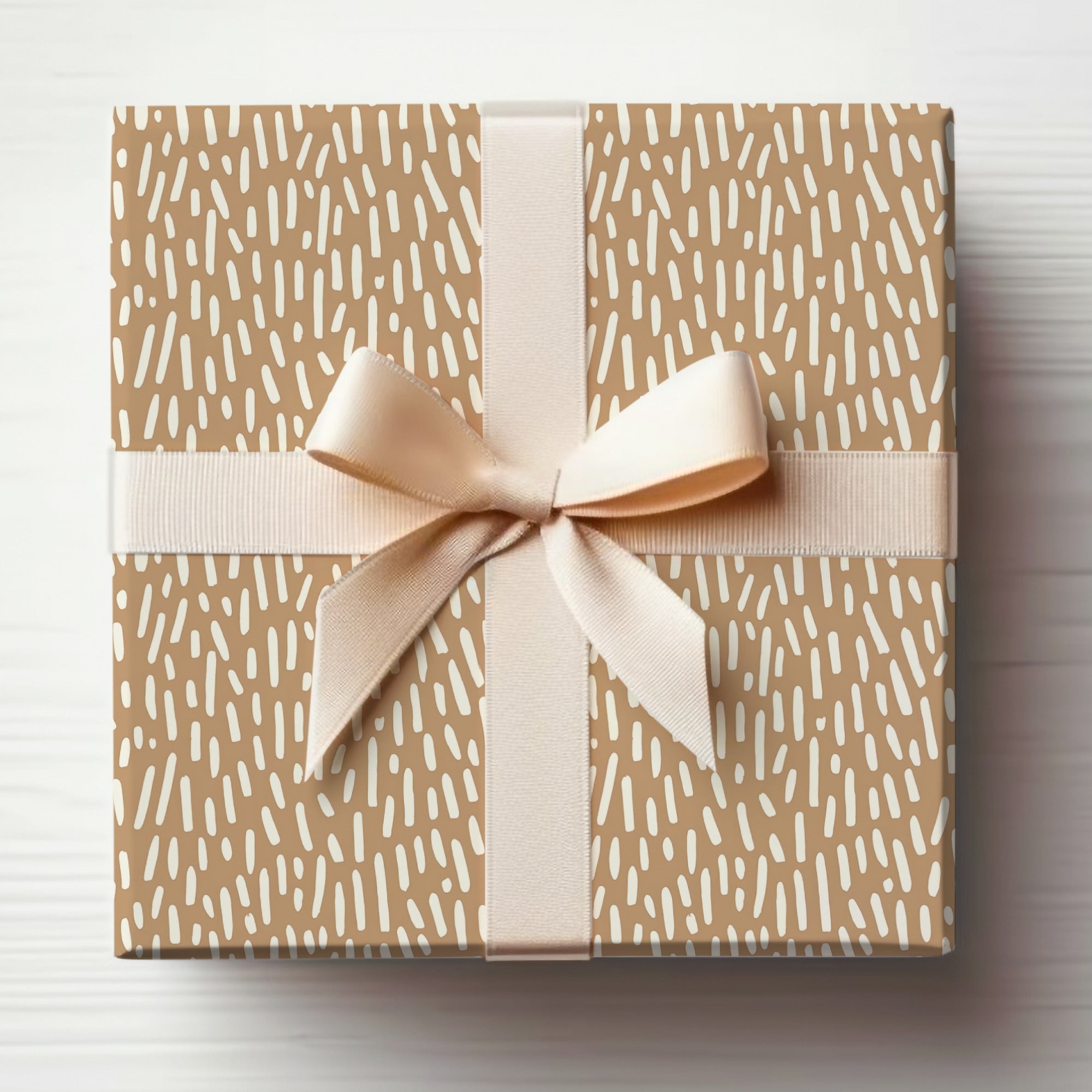 Elegant Beige Gift Wrapped Present with Cream Bow