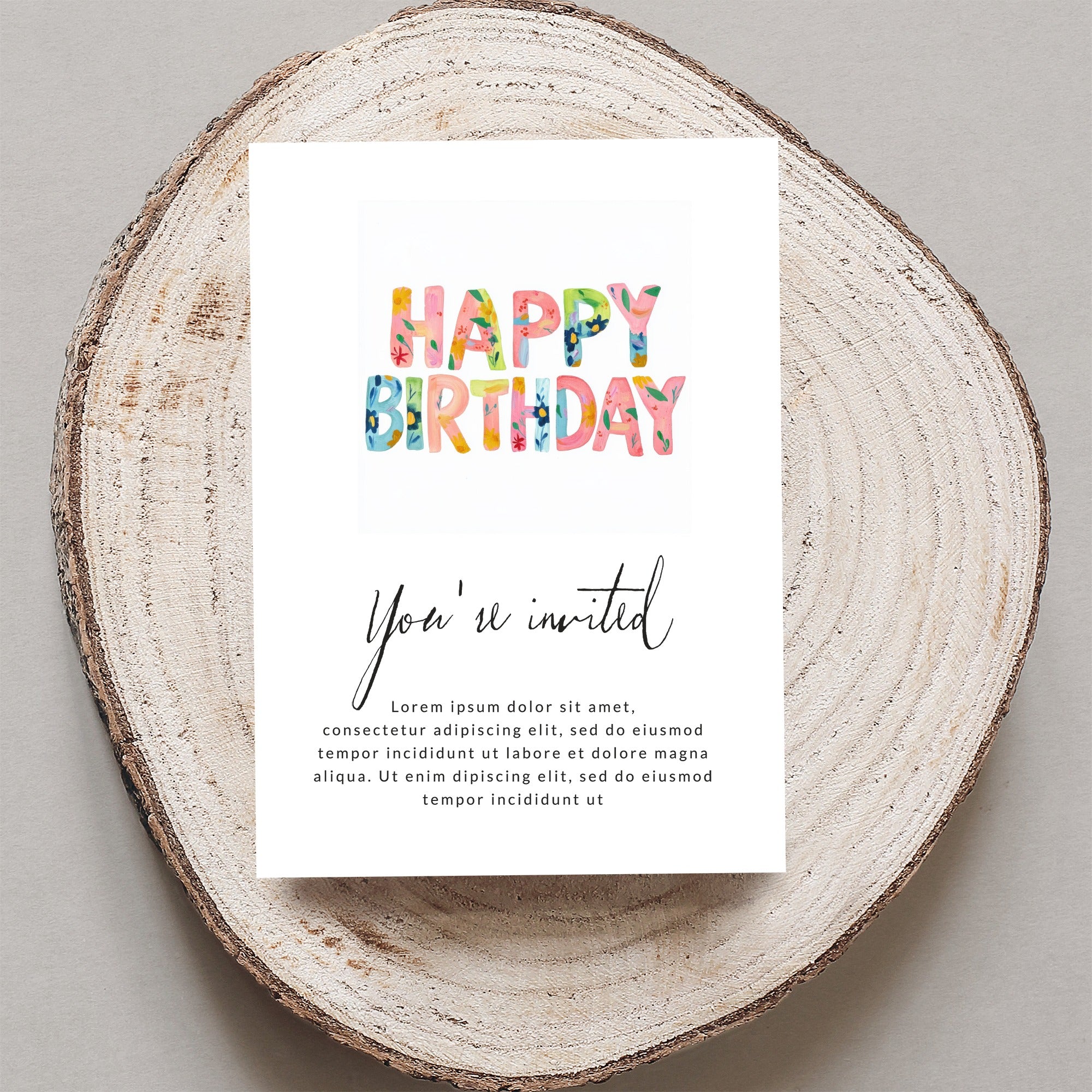 Happy Birthday invitation with floral text, reads "You're invited."