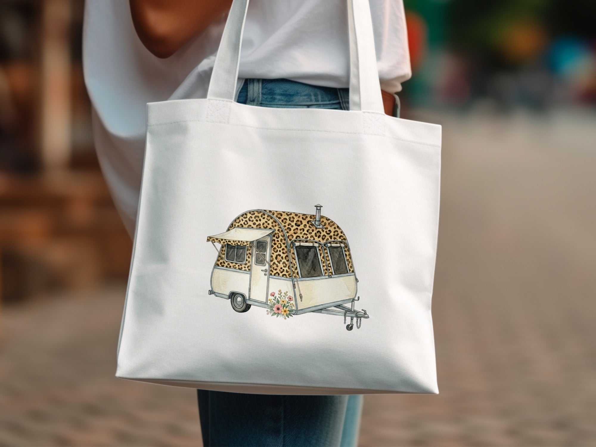 White tote bag with illustration of a leopard print camper van.