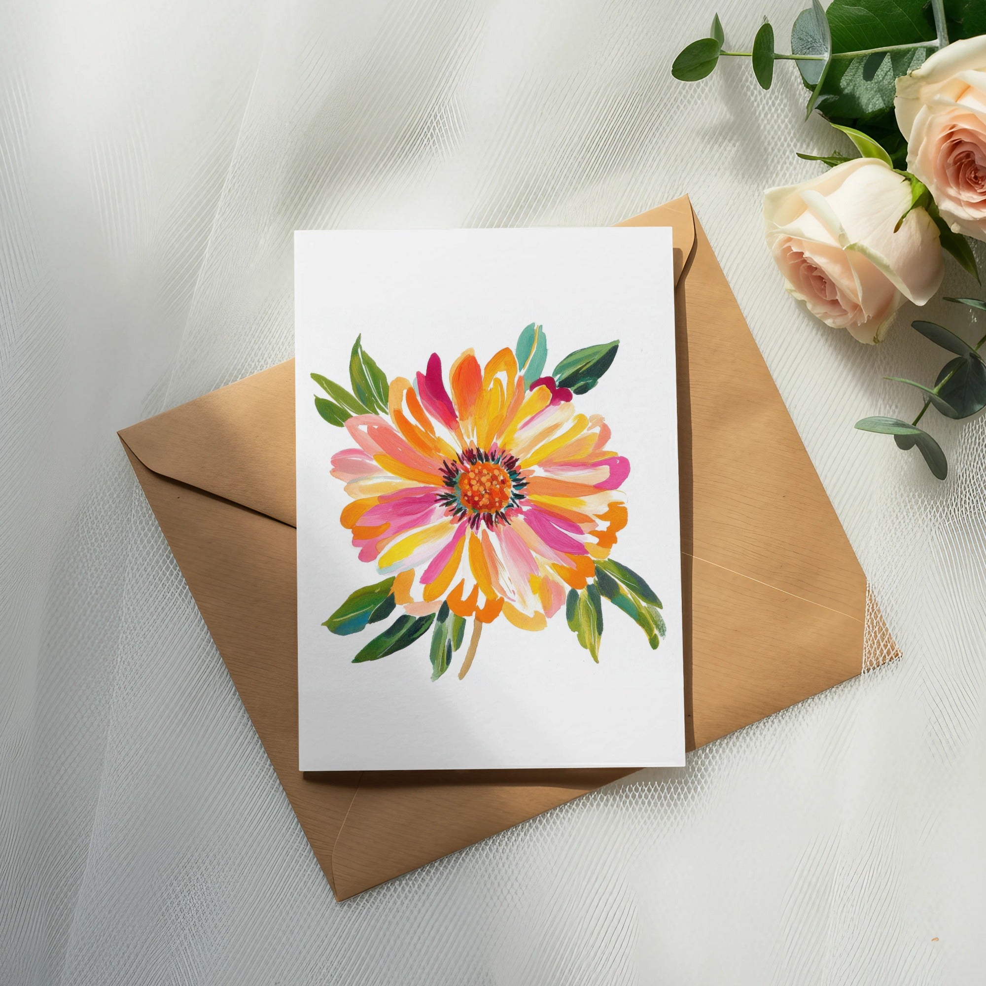 Watercolor painting of a vibrant orange and pink flower on a white card, resting on an envelope.