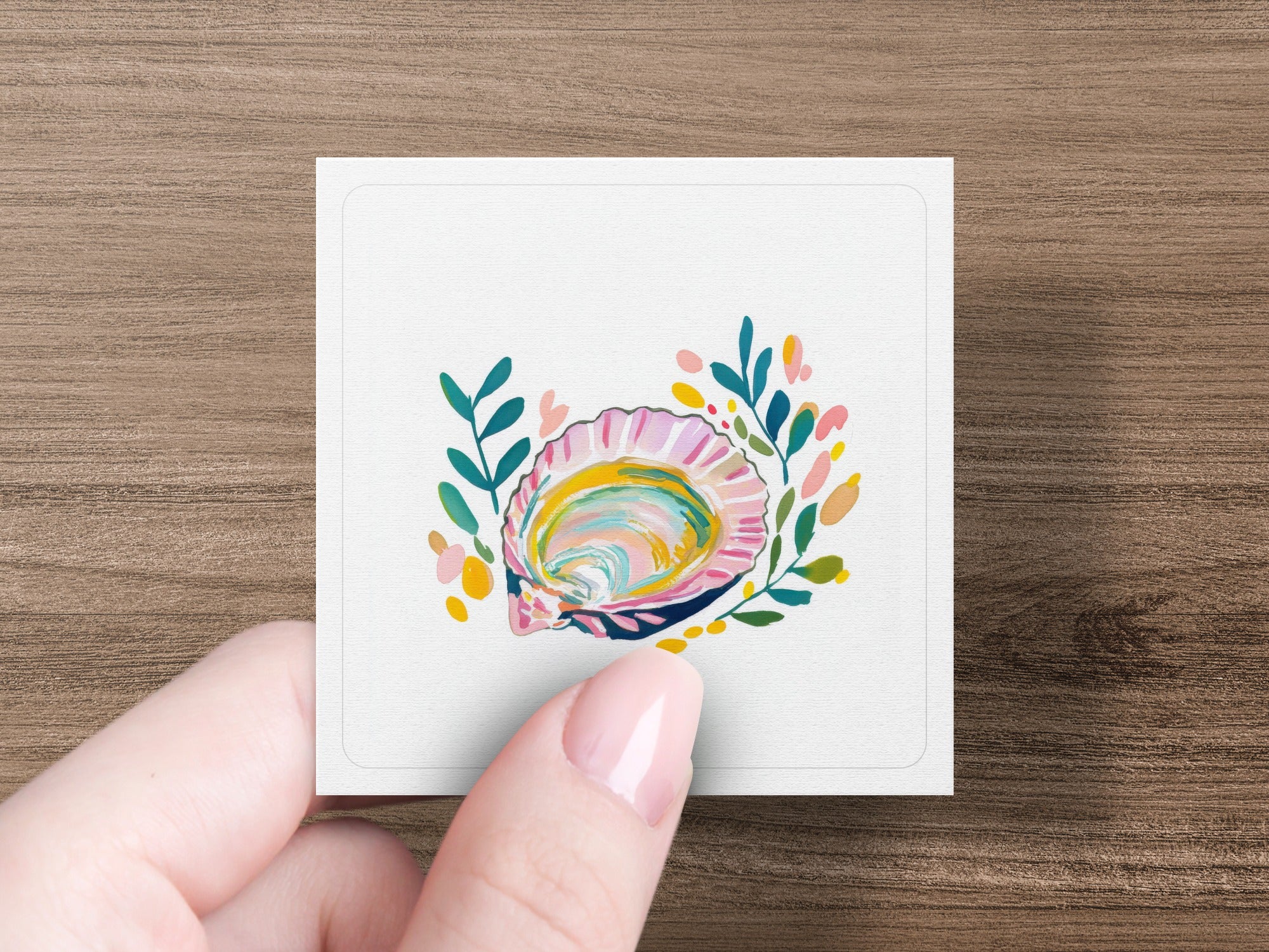 Stylized illustration of an open seashell surrounded by colorful floral accents.