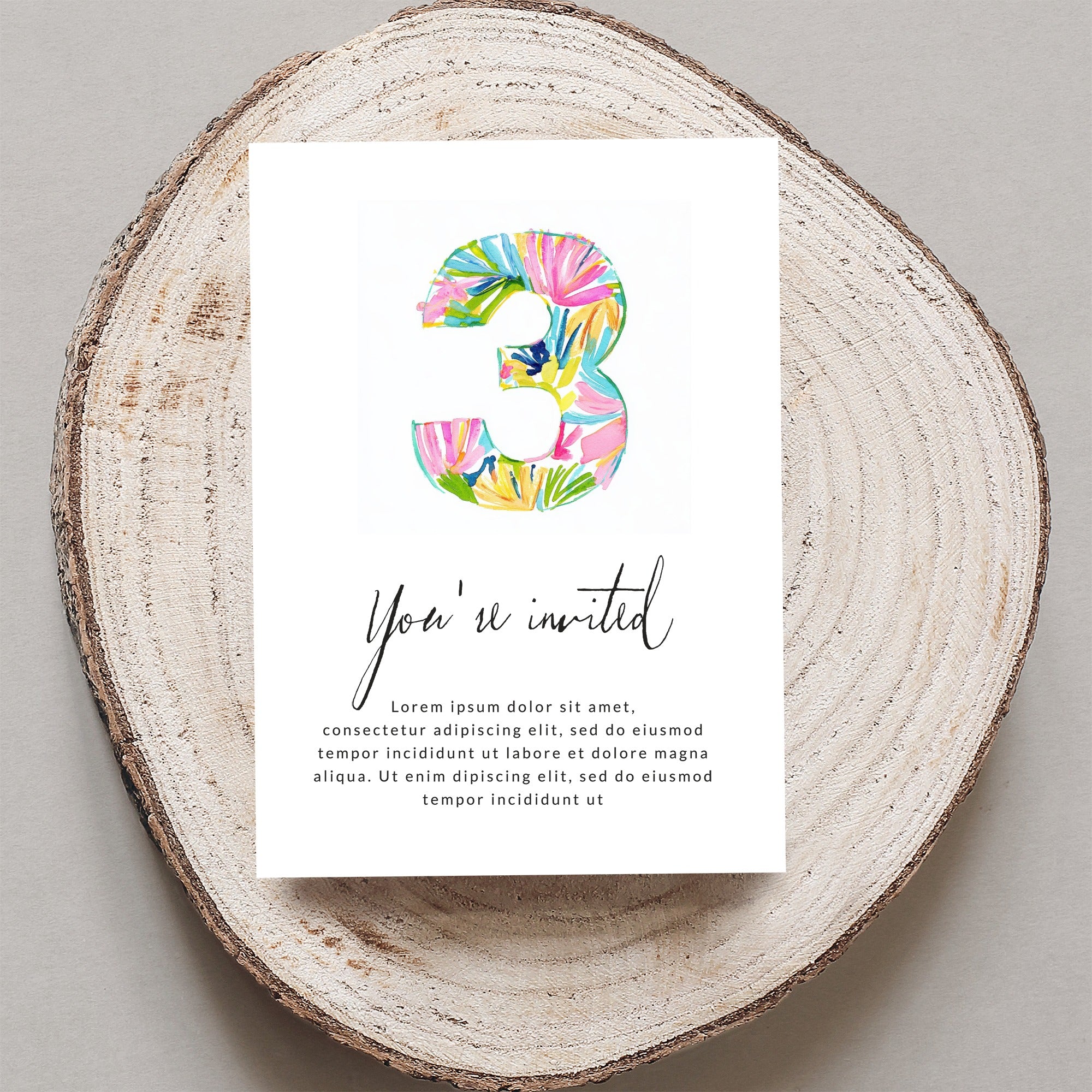 Invitation with large watercolor number 3 and text.