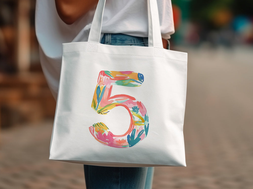 White tote bag with colorful abstract number 5 design.