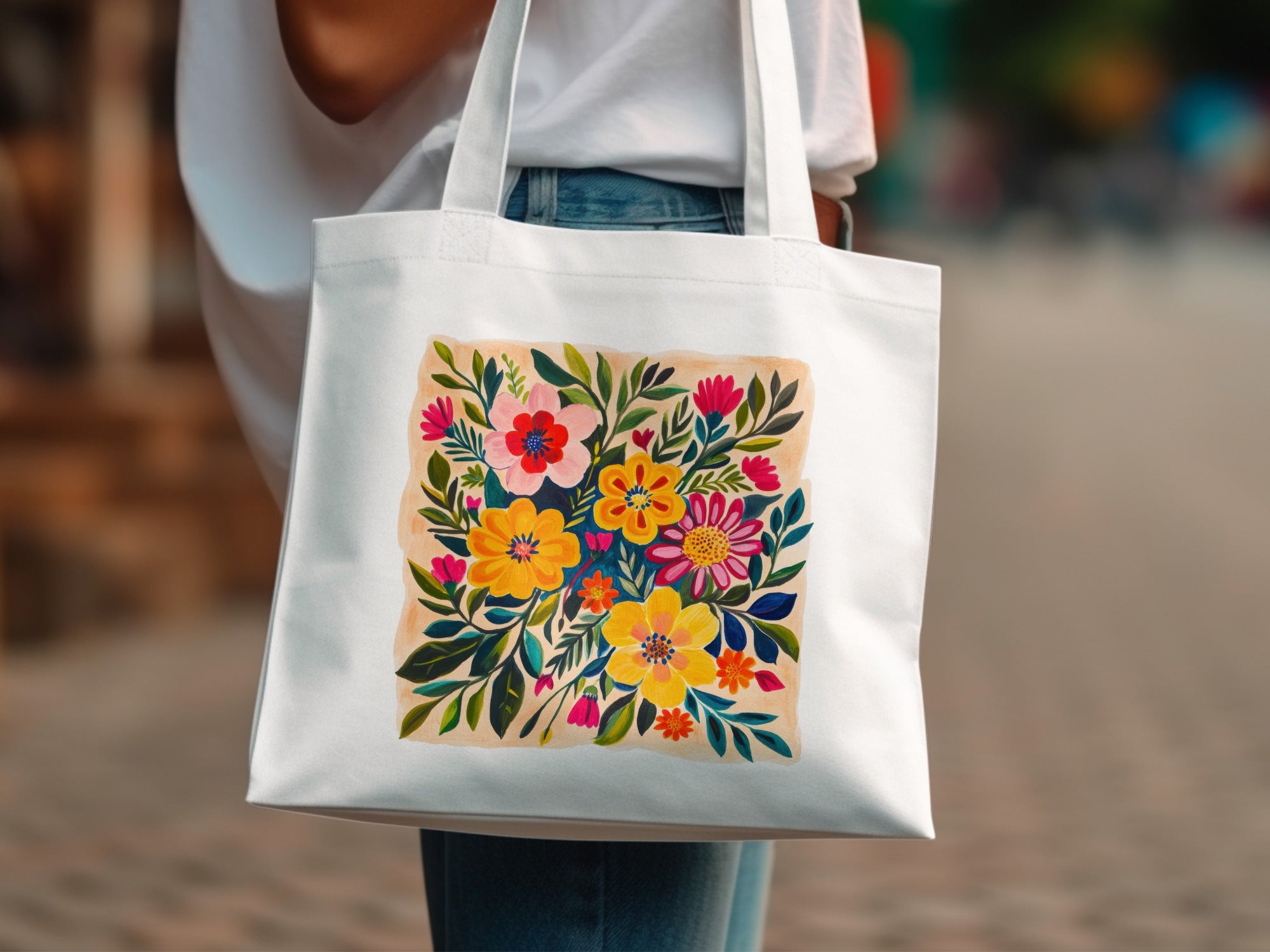 White tote bag with a colorful floral illustration in the center.