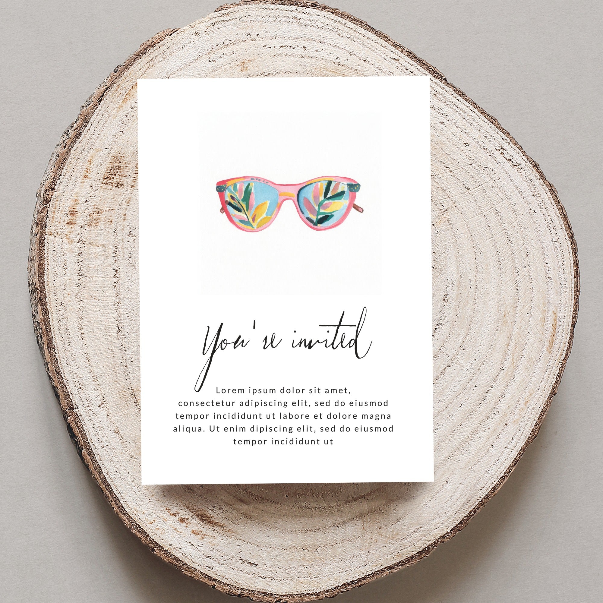 Invitation with colorful sunglasses and cursive "You're invited" text.