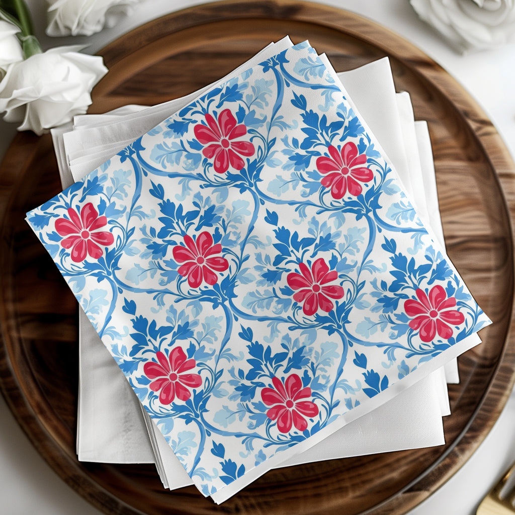 White napkins with a blue and red floral pattern on a wooden tray.