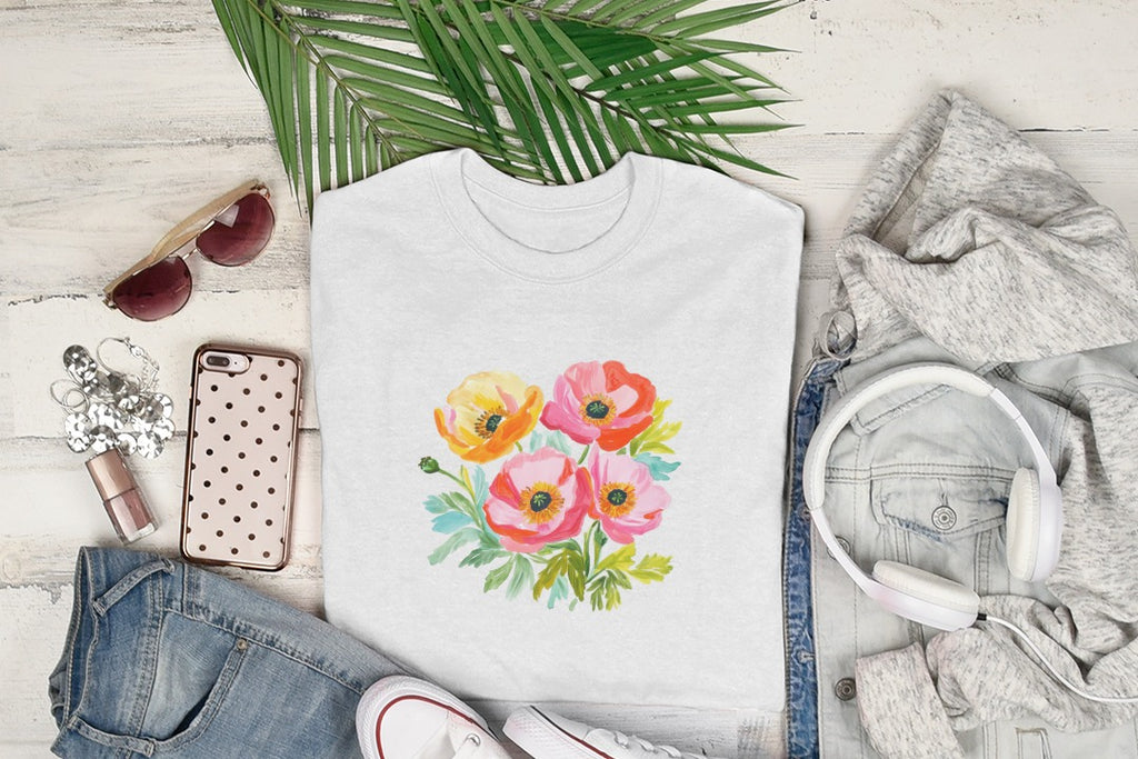 White t-shirt featuring a watercolor bouquet of pink, orange, and yellow poppies.