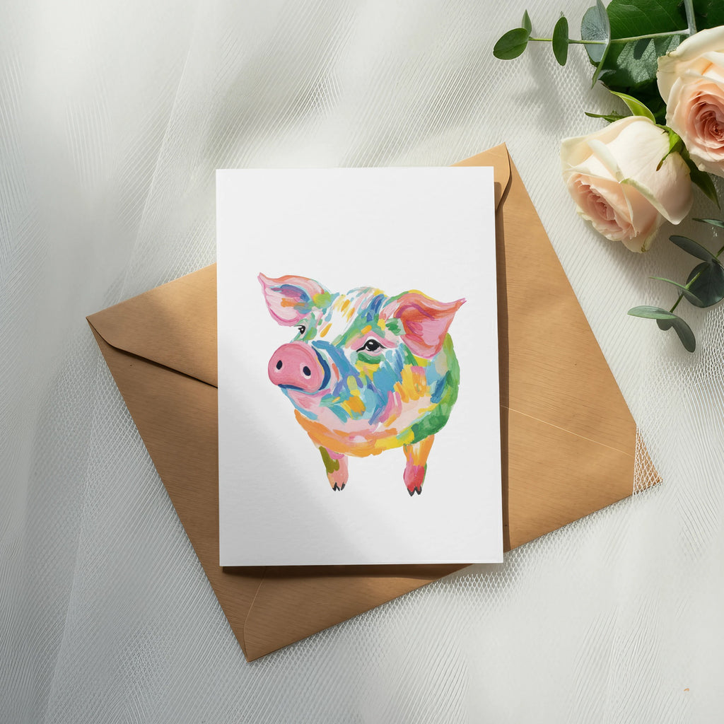 Card with watercolor pig illustration on a brown envelope with roses.