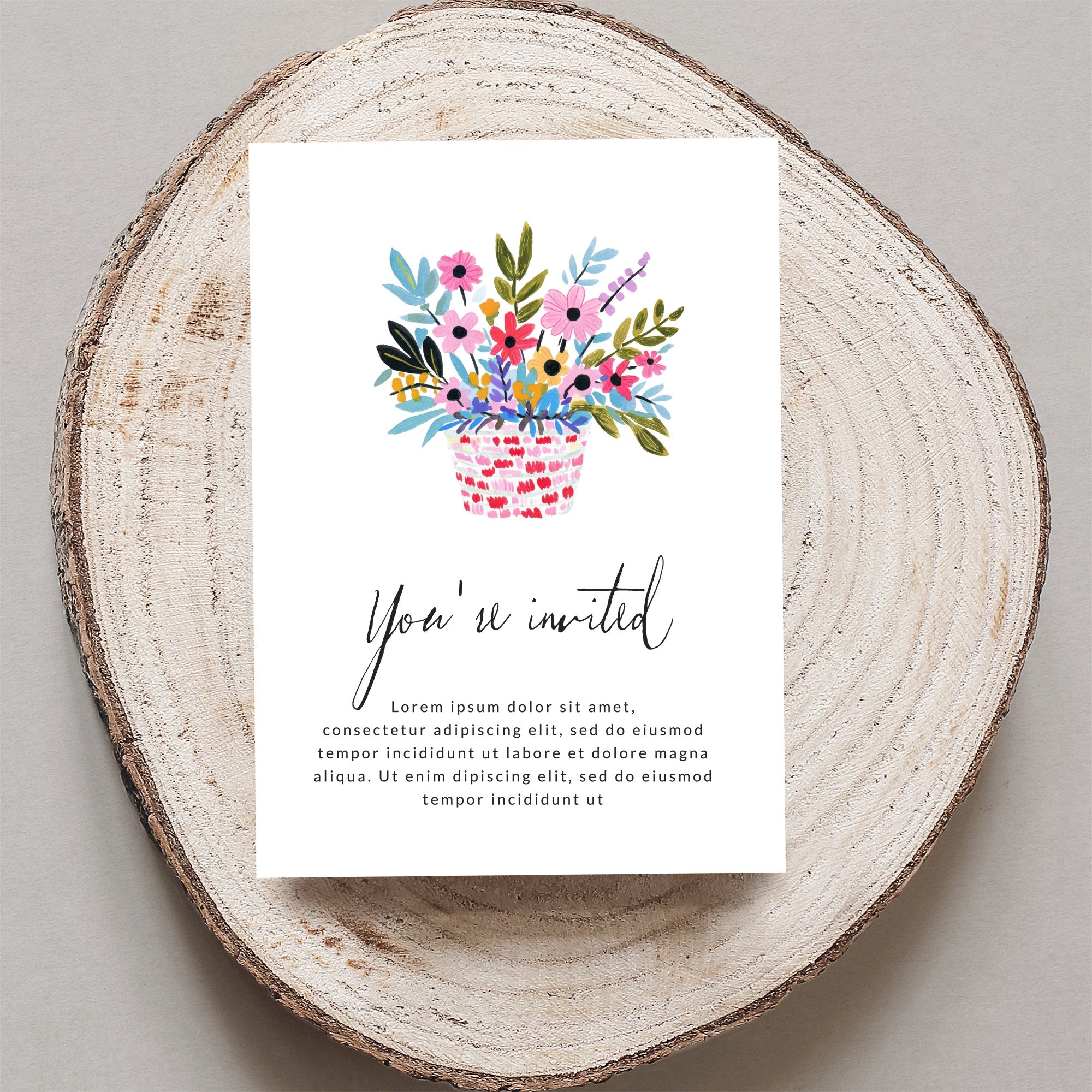 Invitation card with floral basket, "You're invited" and placeholder text.