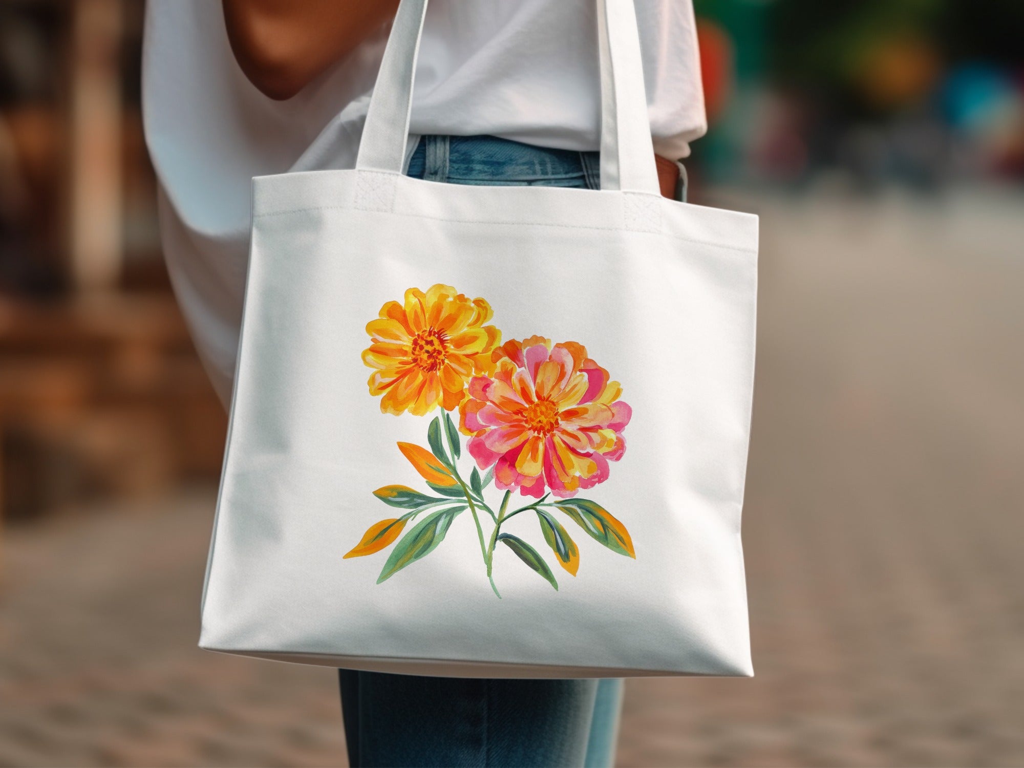 White tote bag with a vibrant watercolor floral print.