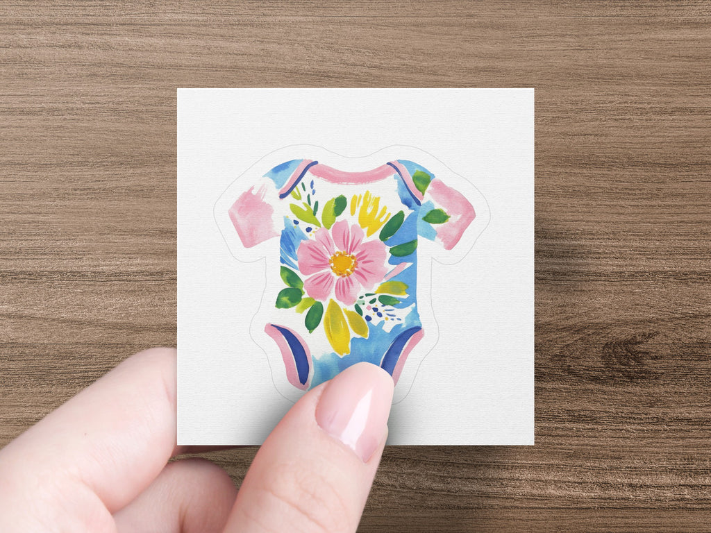 Floral baby onesie sticker with pink, blue, and yellow flowers.