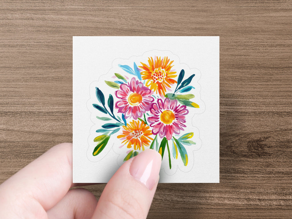 Watercolor bouquet of colorful flowers with green leaves.