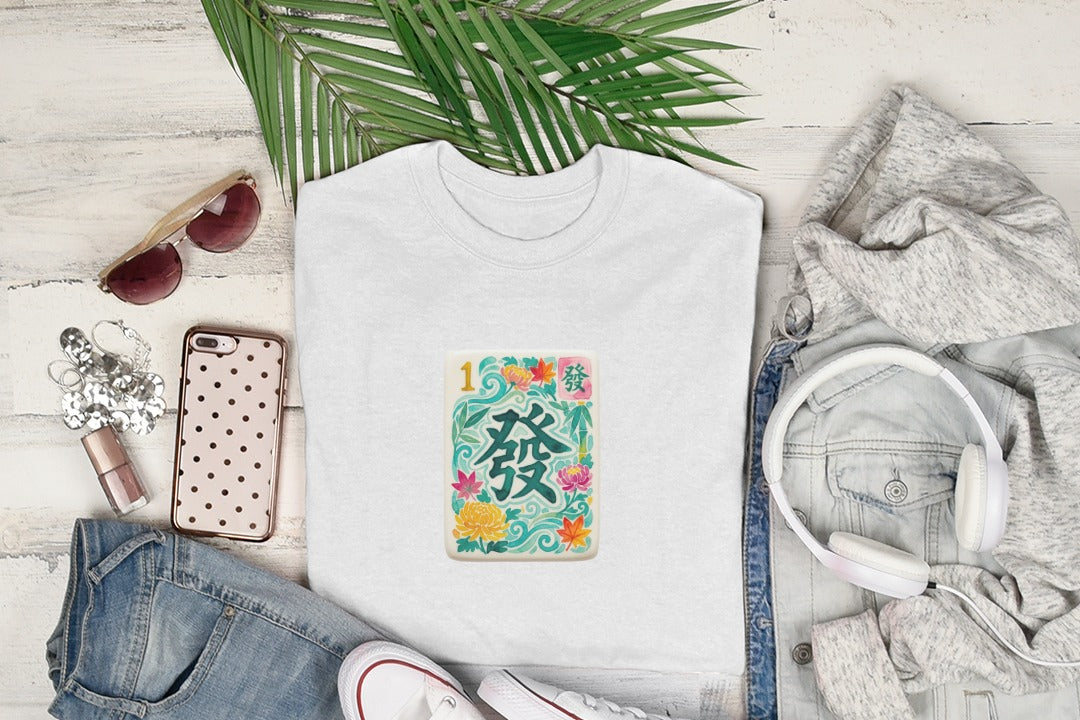 White t-shirt with floral mahjong tile design and sunglasses.