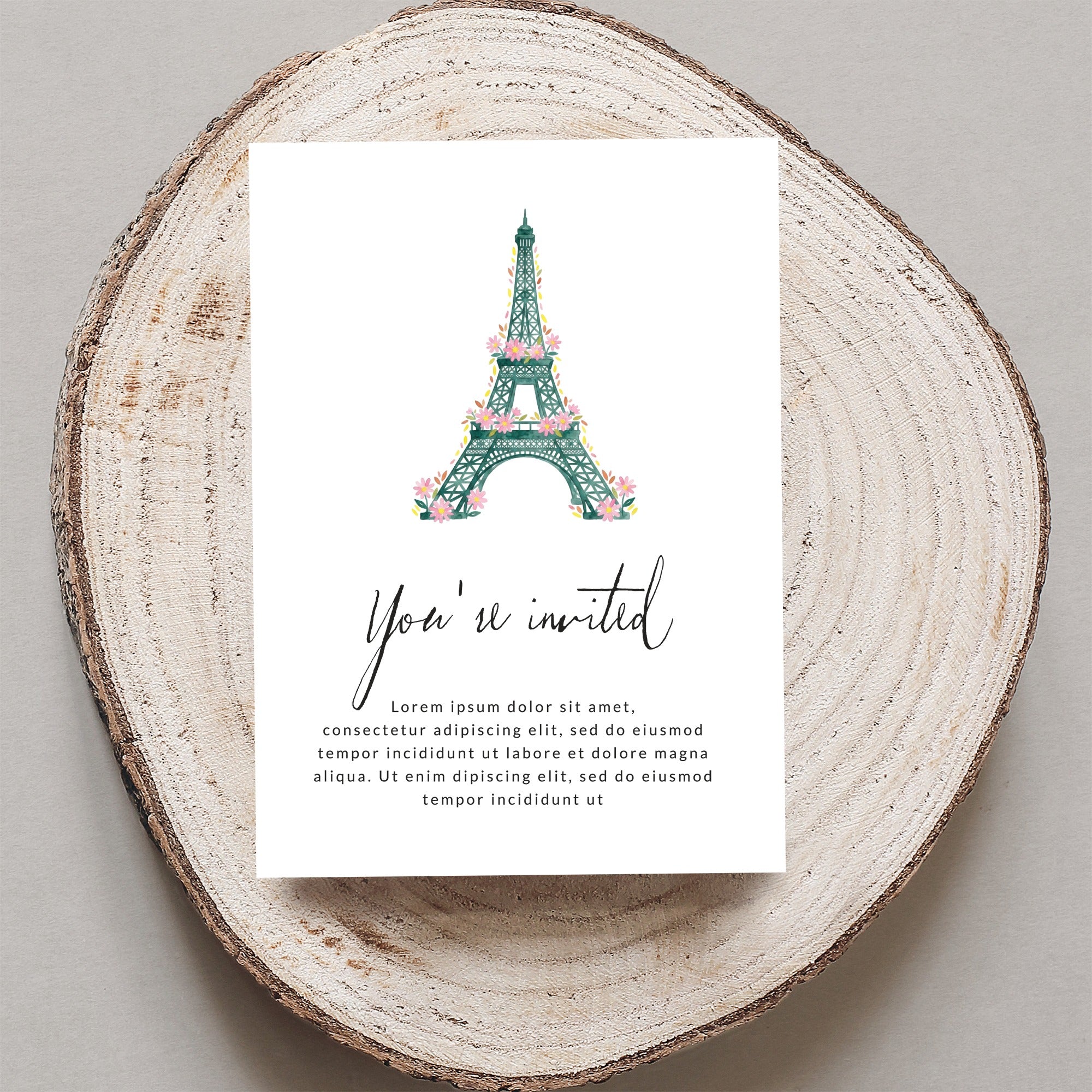 Invitation card with Eiffel Tower illustration and "You're invited" text.