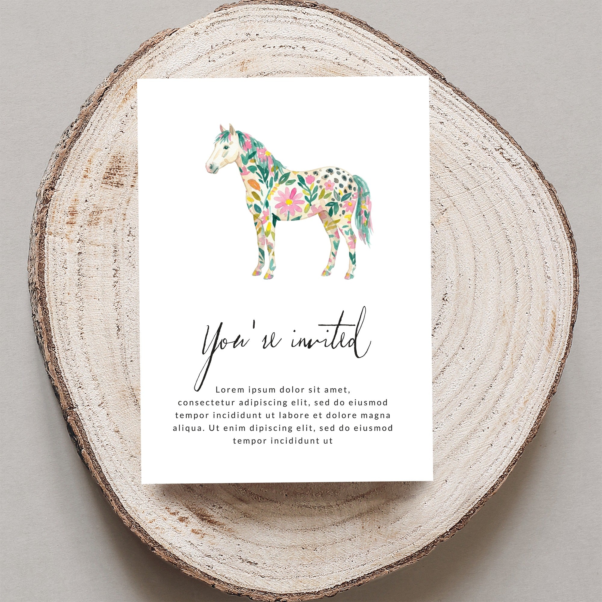 Floral painted horse on invitation with "You're invited" text.
