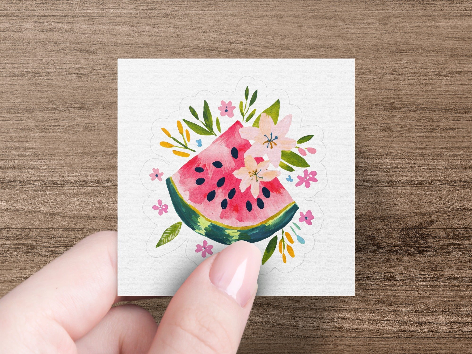 Watercolor slice of watermelon with pink flowers and green leaves.